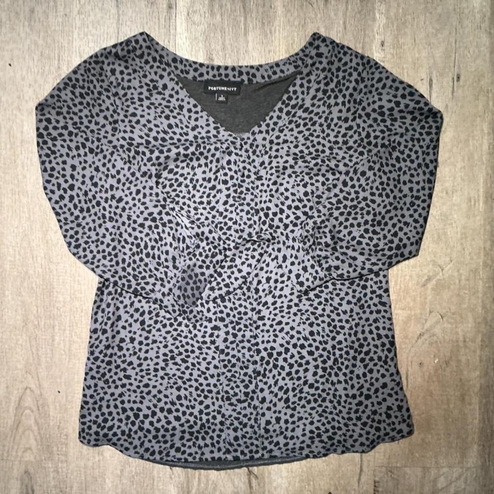 Grey leopard print blouse with ruffle detail and button-up front. Size: S